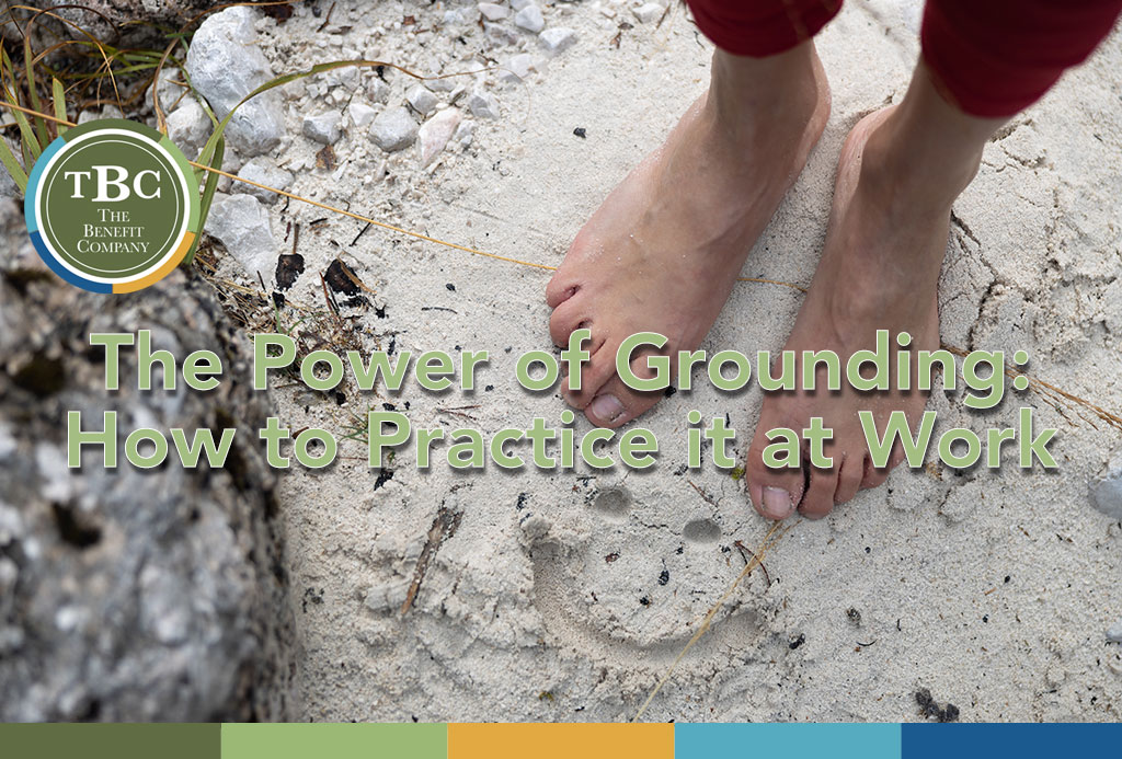 Practicing grounding and earthing at work.